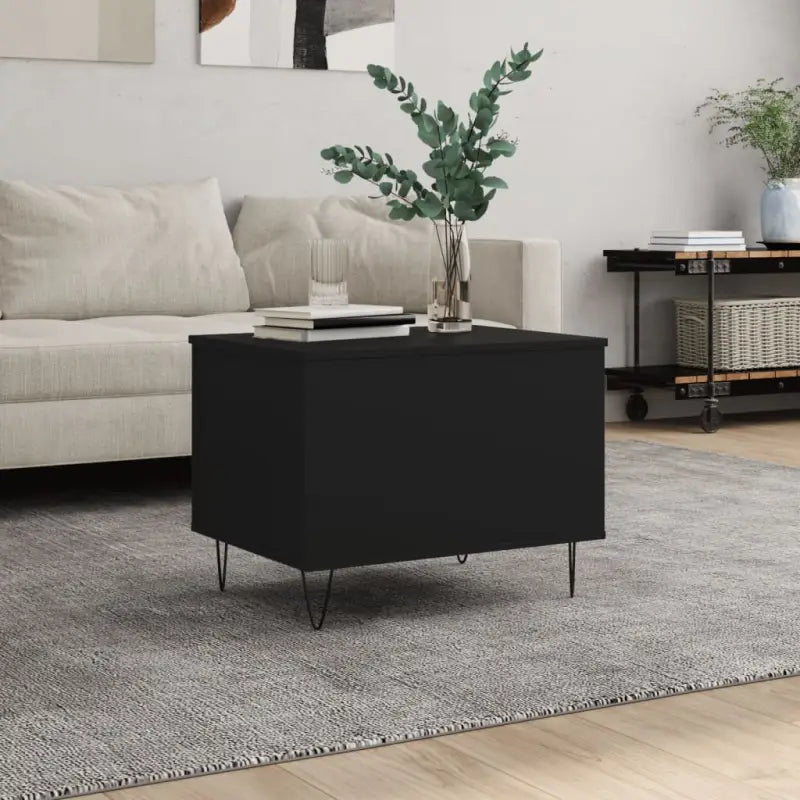 Eenvoudige salontafel met bewerkt hout en metalen poten - Salontafels