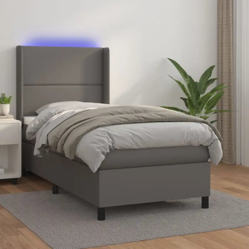 Zwart materialen boxspring met matras en LED voor een rustgevende slaapkamer - Grijs / 90 x 190 cm / Effen met spijkers